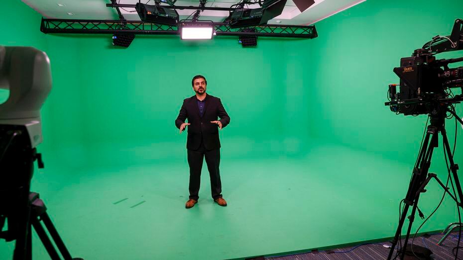 Ali Emam, Nokia's head of demo digital customer journey, demonstrates green screen...