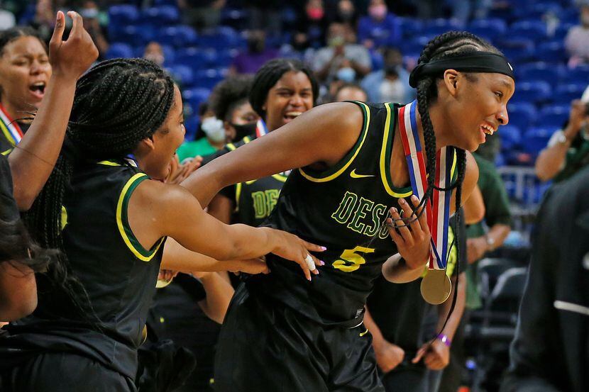 DeSoto Sa’Myah Smith #5 is congratulated by teammates after winning most valuable player....