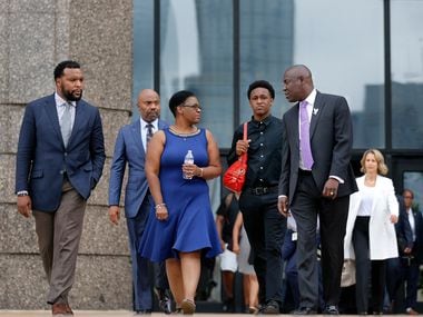 Flanked by her attorneys Lee Merritt (left) and Benjamin Crump (right), mother of shooting...