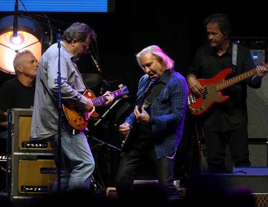 Joe Walsh (center) and Vince Gill (far left) lay into "Rocky Mountain Way" while performing...