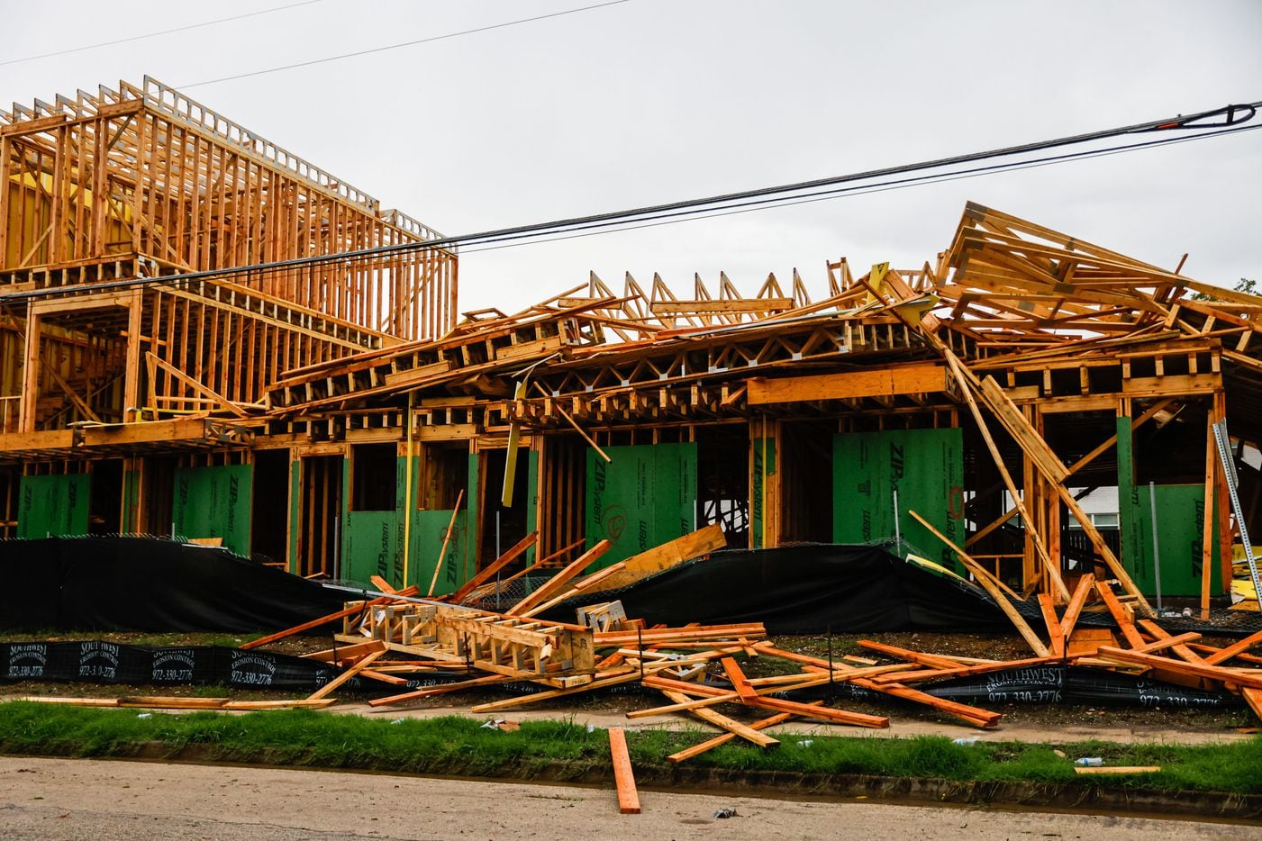 A townhouse construction partially collapsed at Munger Ave and Annex Ave after a severe...