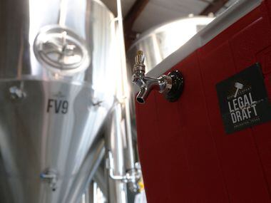 A spigot in front of fermintation tanks at Legal Draft Beer Co. in Arlington, Texas Oct. 1,...