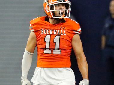 Rockwall High School free safety Jake Overstreet (11) celebrates a defensive stop during the...