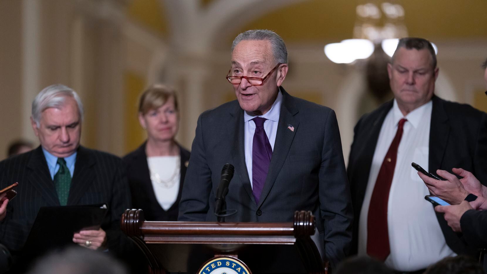 Senate Majority Leader Chuck Schumer, D-N.Y., joined from left by Sen. Jack Reed, D-R.I.,...