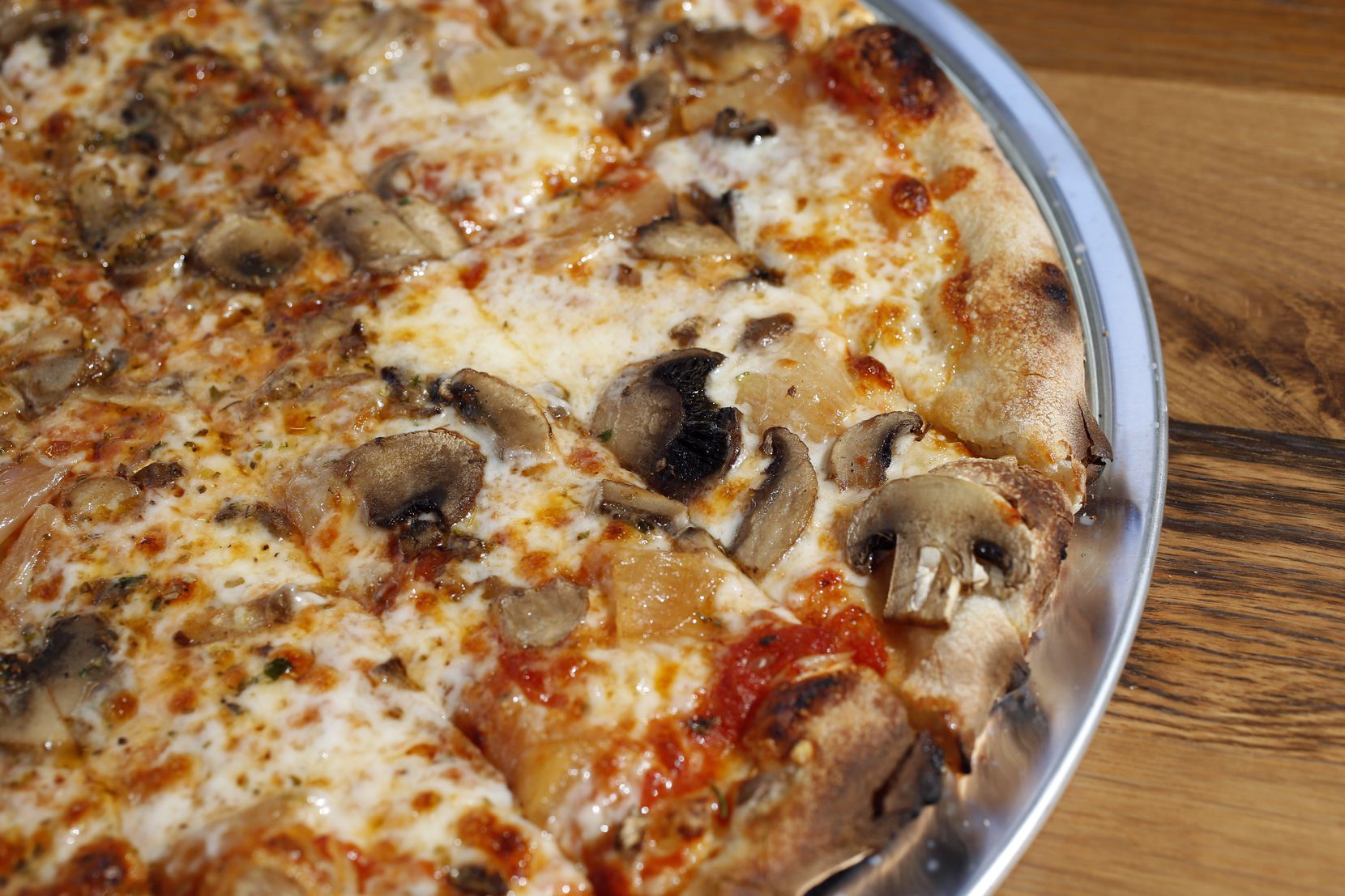 The Lower Greenville Community pizza at Flatbread Company is a vegetarian pizza topped with...
