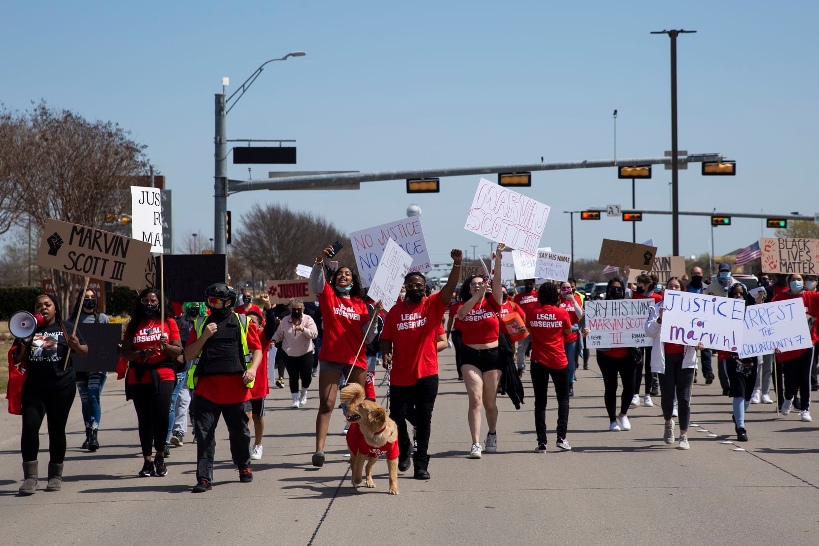 People march to the Allen Outlets on Sunday, March 21, 2021 demanding justice for Marvin...