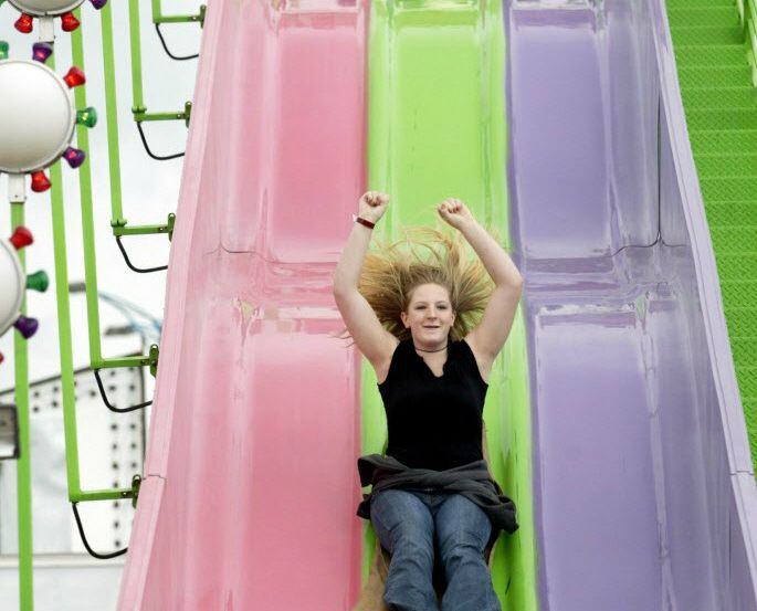 Randi McRae tries the Super Slide, one of many carnival rides, at the 2014 Wild West Watauga...