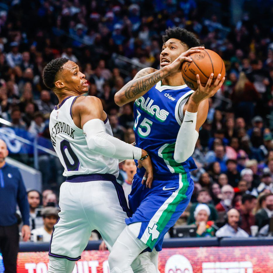 Dallas Mavericks forward Christian Wood (35) tries to pass the basketball as Los Angeles...