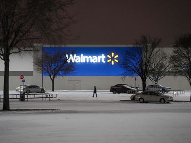 The parking lot of a Walmart Store on Coit Road empties as a second winter storm brought...