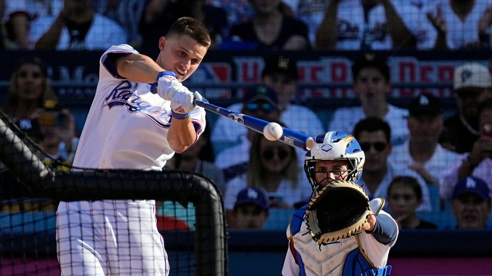 American League's Corey Seager, of the Texas Rangers, bats during the MLB All-Star baseball...