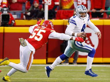 Dallas Cowboys quarterback Dak Prescott (4) is chased by Kansas City Chiefs defensive end...