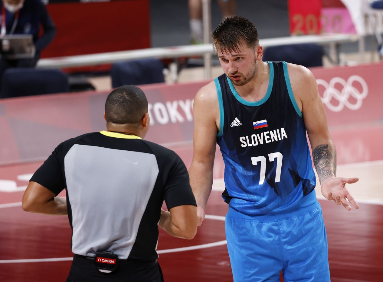 Slovenia’s Luka Doncic (77) talks to a referee in the second half of play in a game against...