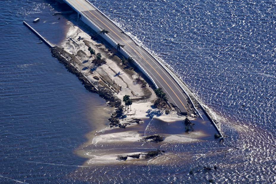 Damage to a causeway leading to Sanibel Island in Flordia is visible in this aerial photo by...