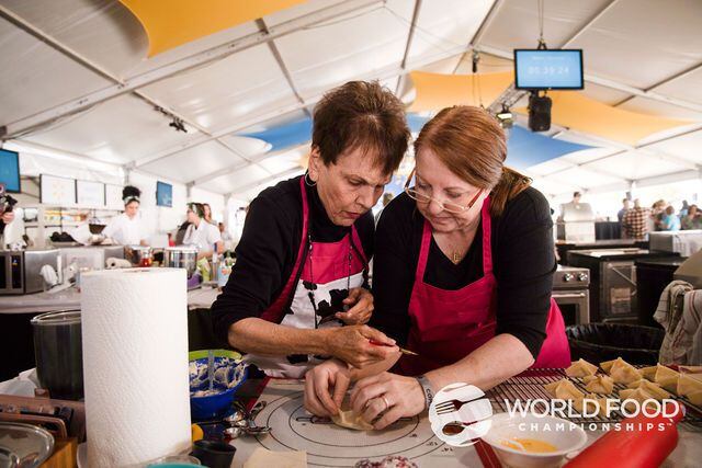 Two chefs work on a dish for the 2019 World Food Championships. This year's event will host...