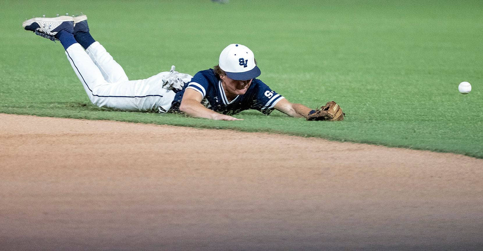 A ground ball hit by Rockwell-Heath Caleb Hoover, (7), gets past Comal Smithson Valley...