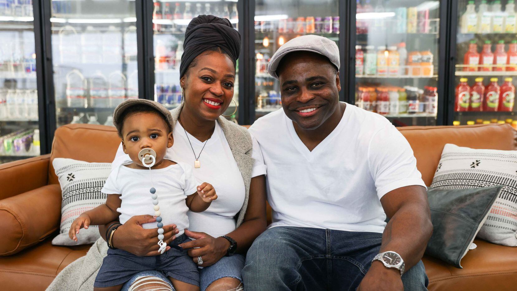 Eugene and LaToyah Vessel, with their son Eugene, pose together for a portrait at the Sweet Grass Market in Dallas.