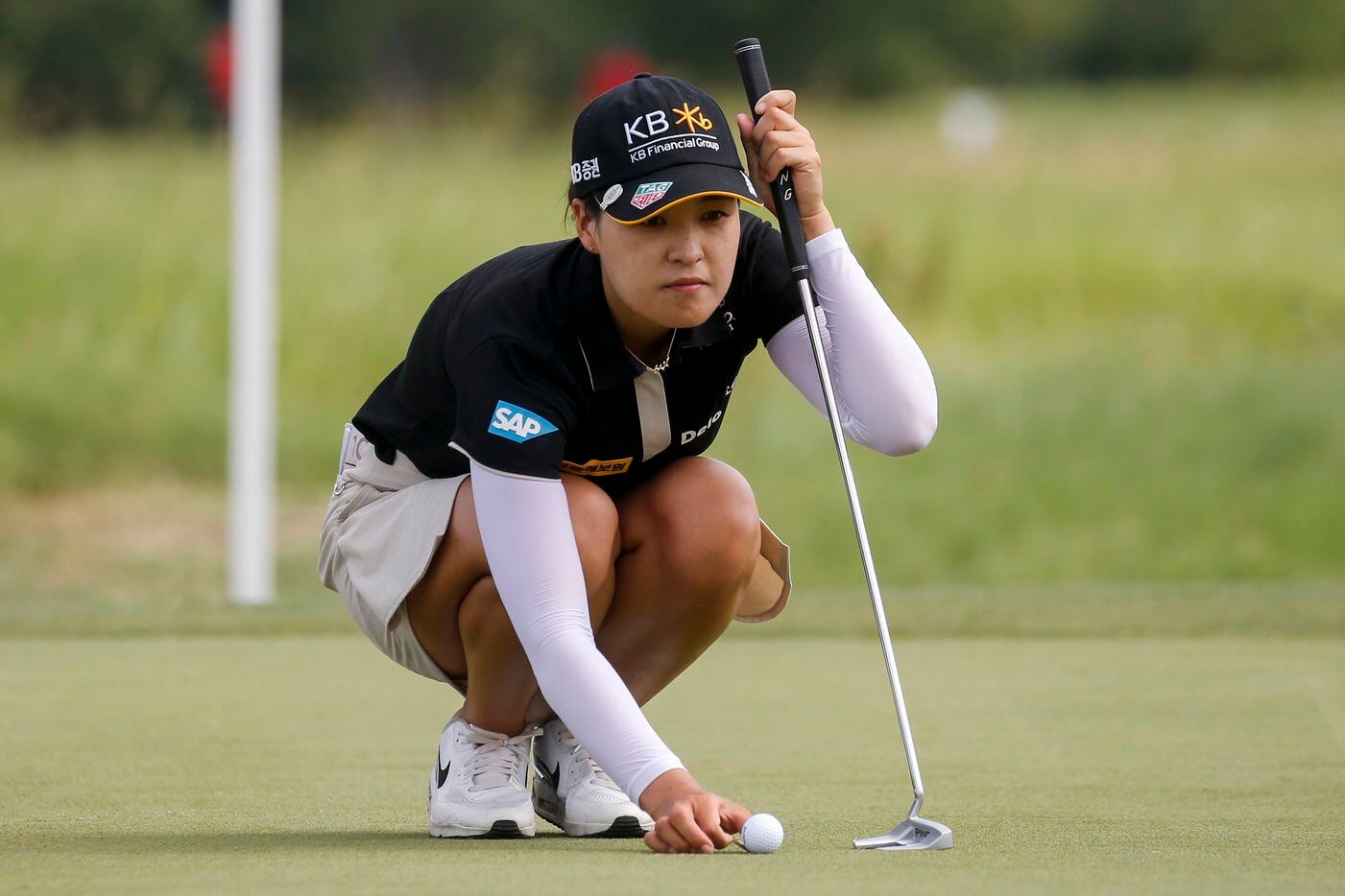 Professional golfer In Gee Chun lines up a putt on the No. 8 green during the second round...