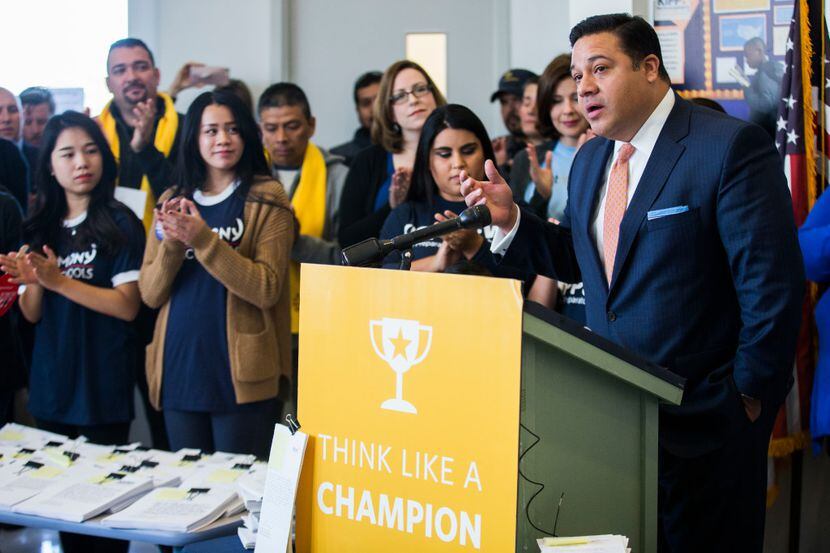 State Rep. Jason Villalba speaks as parents of children enrolled in charter schools gathered...