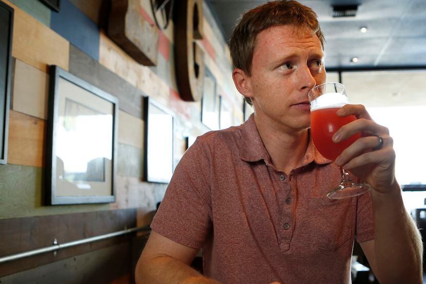 Jay Frank tries a beer at Lakewood Growler, photographed September 26, 2014.