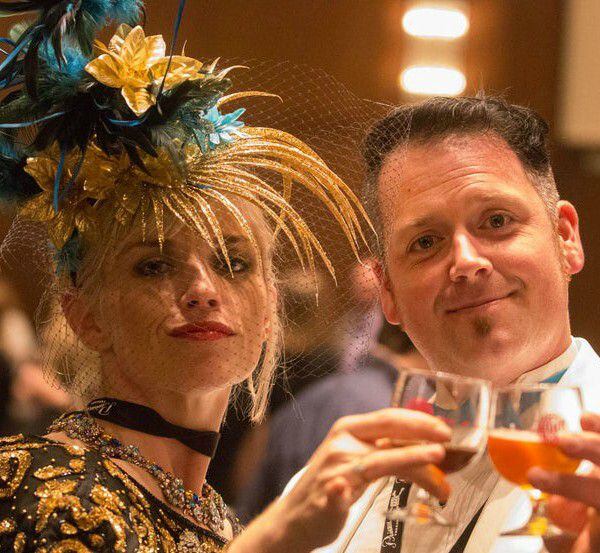 Michelle and David Muckian raise their glasses at the 2015 Brewer’s Ball. 