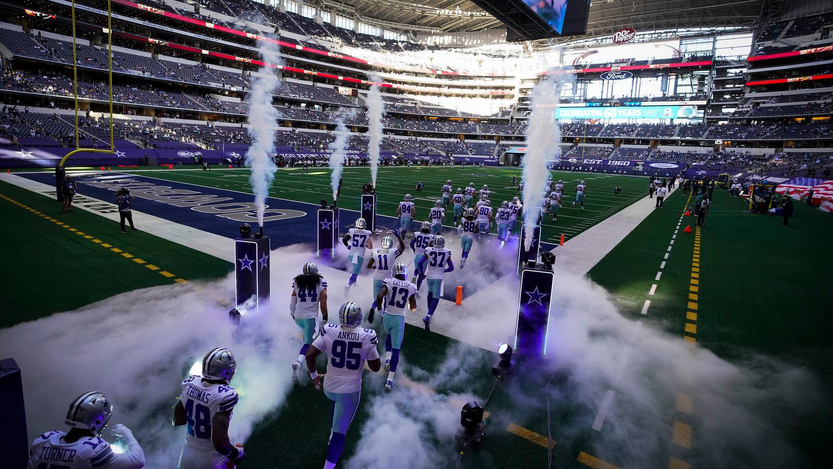 The Dallas Cowboys take the field to face the Philadelphia Eagles in an NFL football game at...