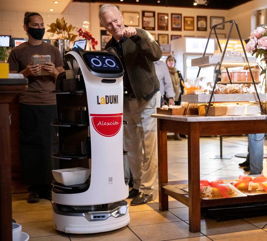 Robot Alexcita delivers drinks at La Duni on Thursday.