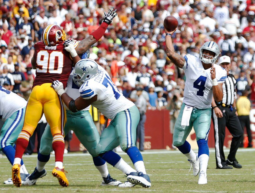 Dallas Cowboys quarterback Dak Prescott (4) throws to Dallas Cowboys wide receiver Dez...