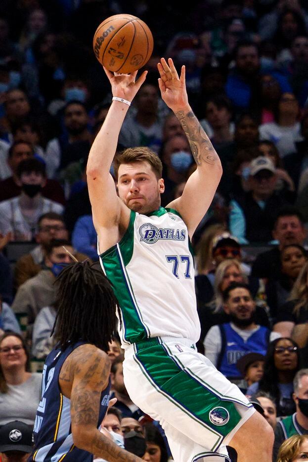 Dallas Mavericks guard Luka Doncic (77) looks to pass the ball during the third quarter...
