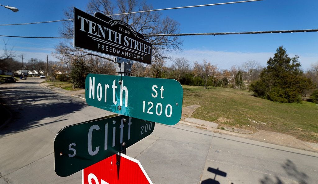 A street sign topper reminds residents of the historic Tenth Street Freedmanstown east of...