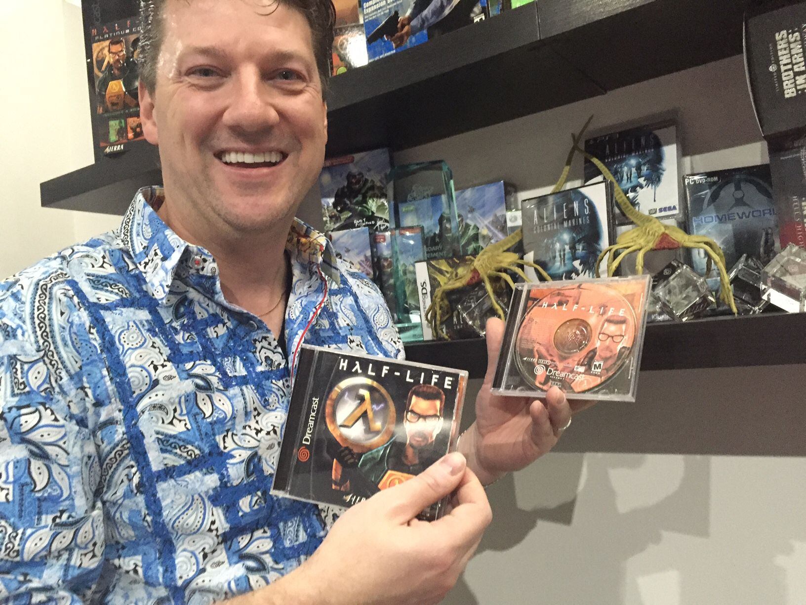Randy Pitchford showing off copies of Half-Life for the Dreamcast -- a game that was fully developed but never released in stores.