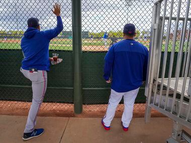 Texas Rangers co-pitching coach Brendan Sagara (right) and minor league catching coordinator...