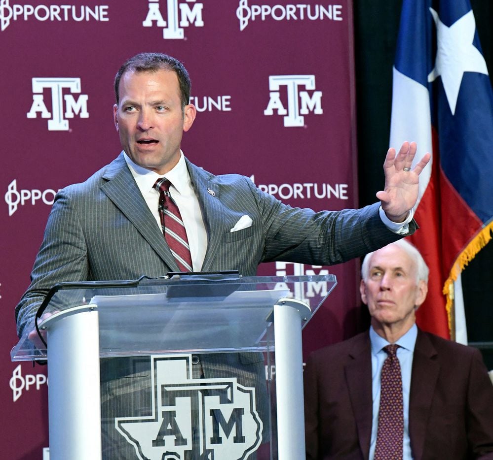 New Texas A&M athletic director Ross Bjork, left, addresses media and A&M athletic staff in...