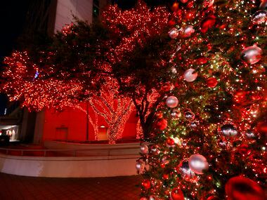The holiday trees glow red outside Galleria Dallas.