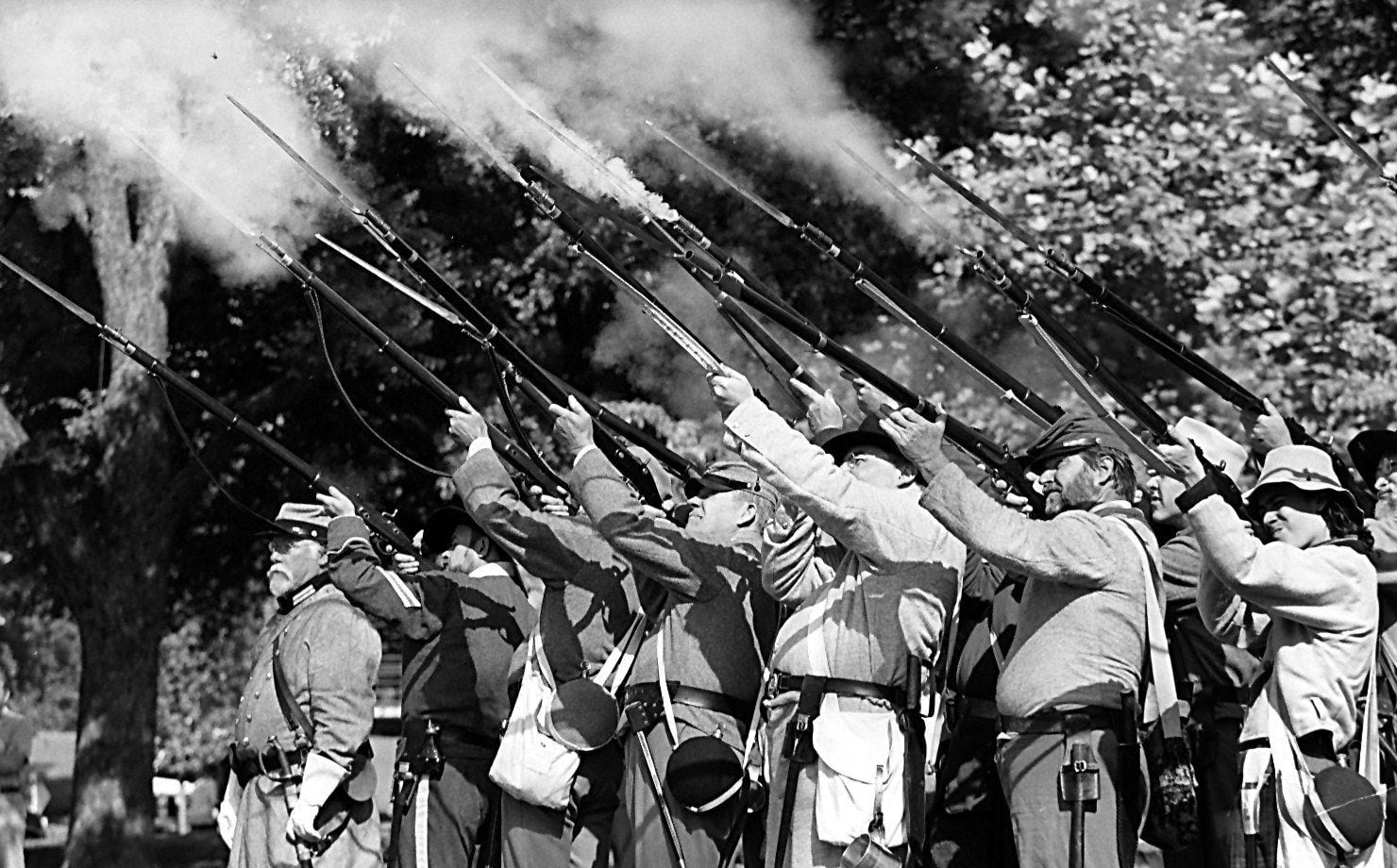 Re-enactors fire their guns to  honor and salute Confederate heroes at the third annual...