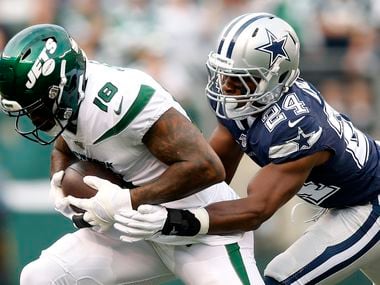 FILE - Cowboys cornerback Chidobe Awuzie (24) tackles New York Jets wide receiver Demaryius Thomas (18) during first quarter of a game at MetLife Stadium in East Rutherford, N.J., on Sunday, Oct. 13, 2019.