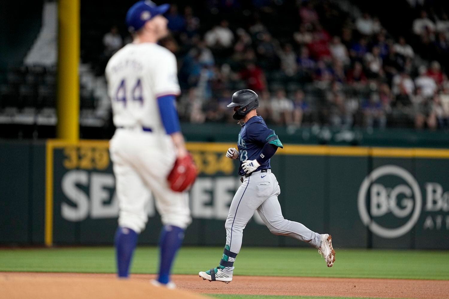 Seattle Mariners' Ty France rounds the bases after hitting a two-run home run off a pitch...