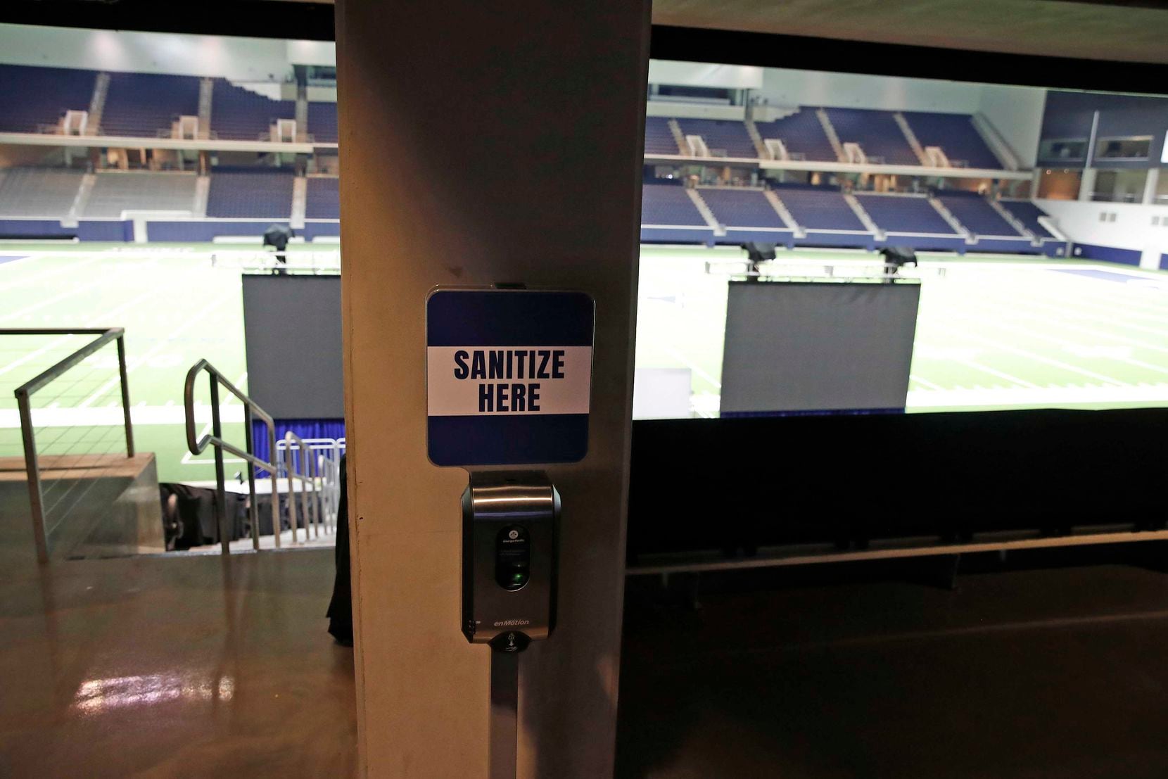 A hand sanitizing station greets Cowboys players and personnel before they step on the field at The Ford Center in Frisco, Texas.