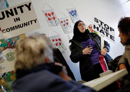 
Alia Salem, a local activist and non-profit executive, speaks to a group during the Facing...