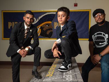 L-R: Principal Tito Salas, fourth grader Levi Espinoza and Mauricio Montoya, of Apollo...