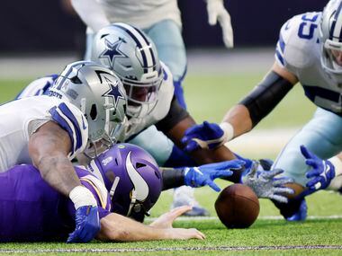 Dallas Cowboys defensive end Dorance Armstrong (second from left) pounces on a fumble by...