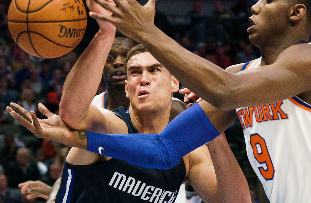 Dallas Mavericks forward Dwight Powell (7) fights for a rebound with New York Knicks guard RJ Barrett (9) during the first half of an NBA basketball game at American Airlines Center on Friday, Nov. 8, 2019, in Dallas. (Smiley N. Pool/The Dallas Morning News)
