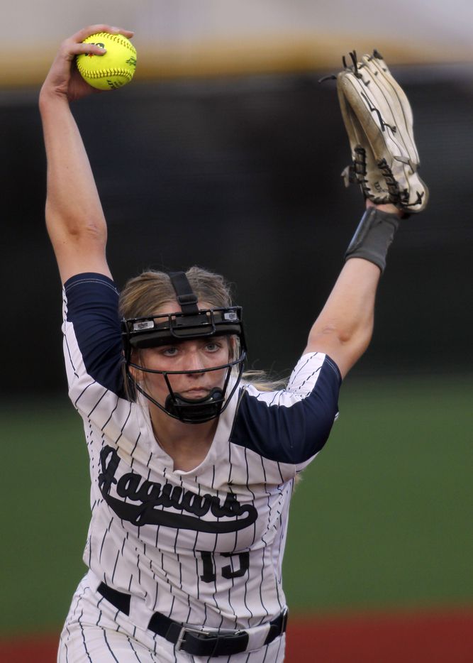 Flower Mound pitcher Landrie Harris (15) goes through the motions before delivering a pitch...