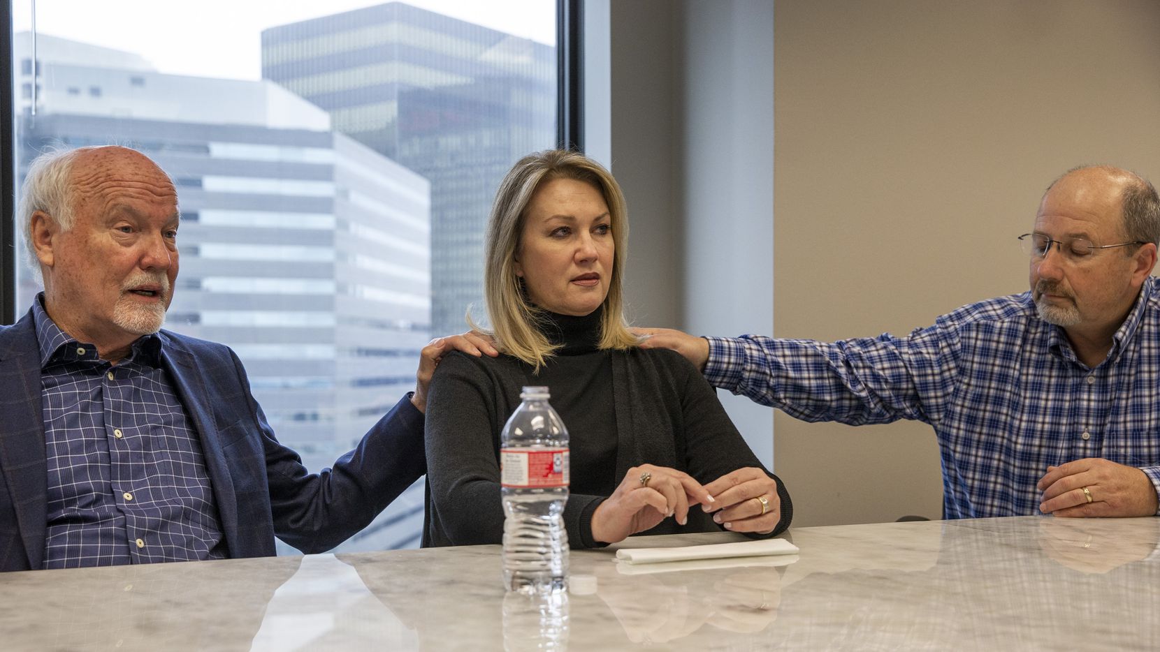 Cliff Harris (from left), his wife, Karen Harris, and her brother, David Nelson recount the details surrounding the 2018 death of the siblings' mother, Miriam Nelson, at Preston Place Retirement Community during a meeting at Dallas attorney Trey Crawford's downtown office. Miriam Nelson is believed to be a victim of serial murder suspect Billy Chemirmir, new lawsuits state.