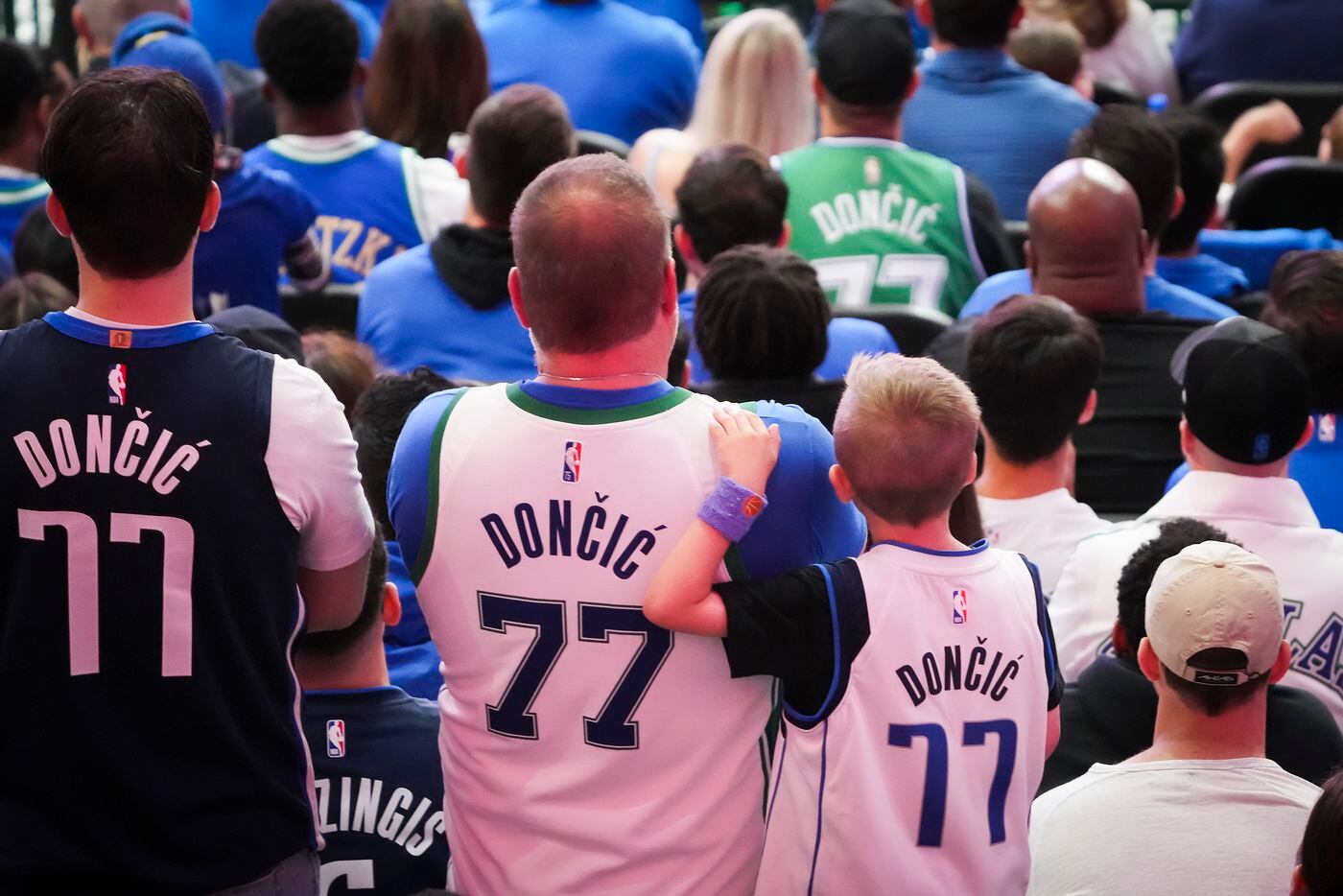 Dallas Mavericks fans watch during the fourth quarter in Game 1 of an NBA first round...
