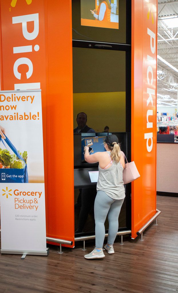 Mackenzie McDaniel of Keller picks up a pair of packages at a North Richland Hills Walmart on April 5, 2019.