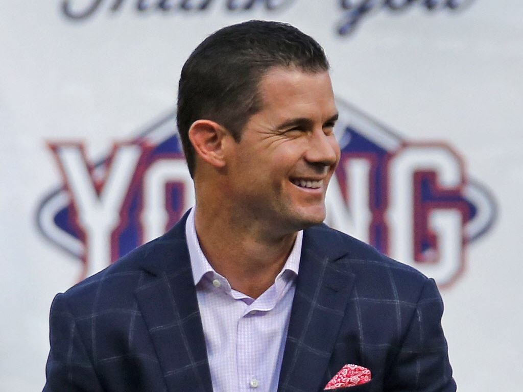 Former Texas infielder Michael Young is all smiles during a ceremony paying tribute to the...