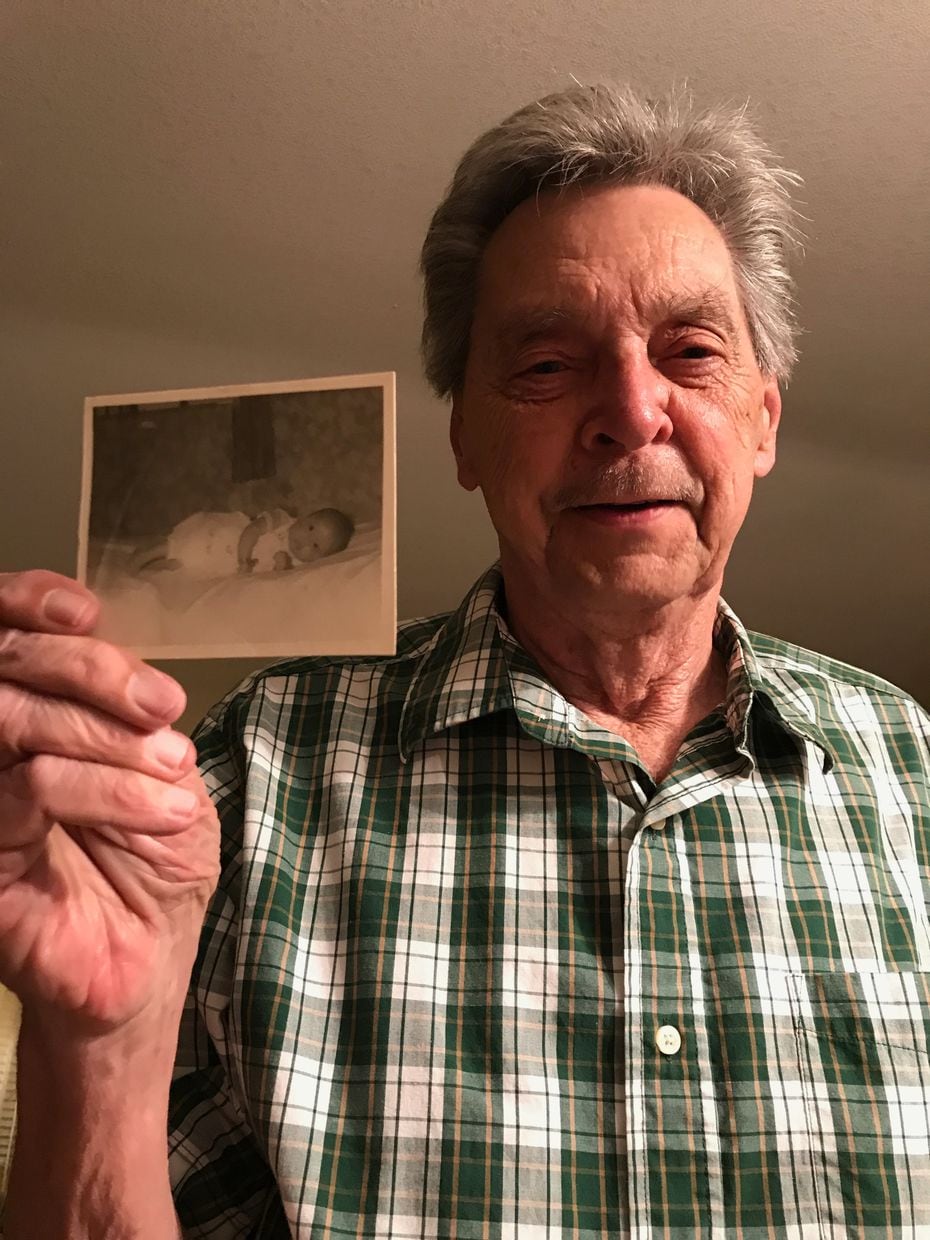 Gilbert Potyandy holds up a photo of Frisco resident Linda Rounds, a Korean adoptee, as a baby. Rounds found Allen, her birth father, in 2018 through the help of 325KAMRA, an organization that helps reunite Korean adoptees with their birth families.