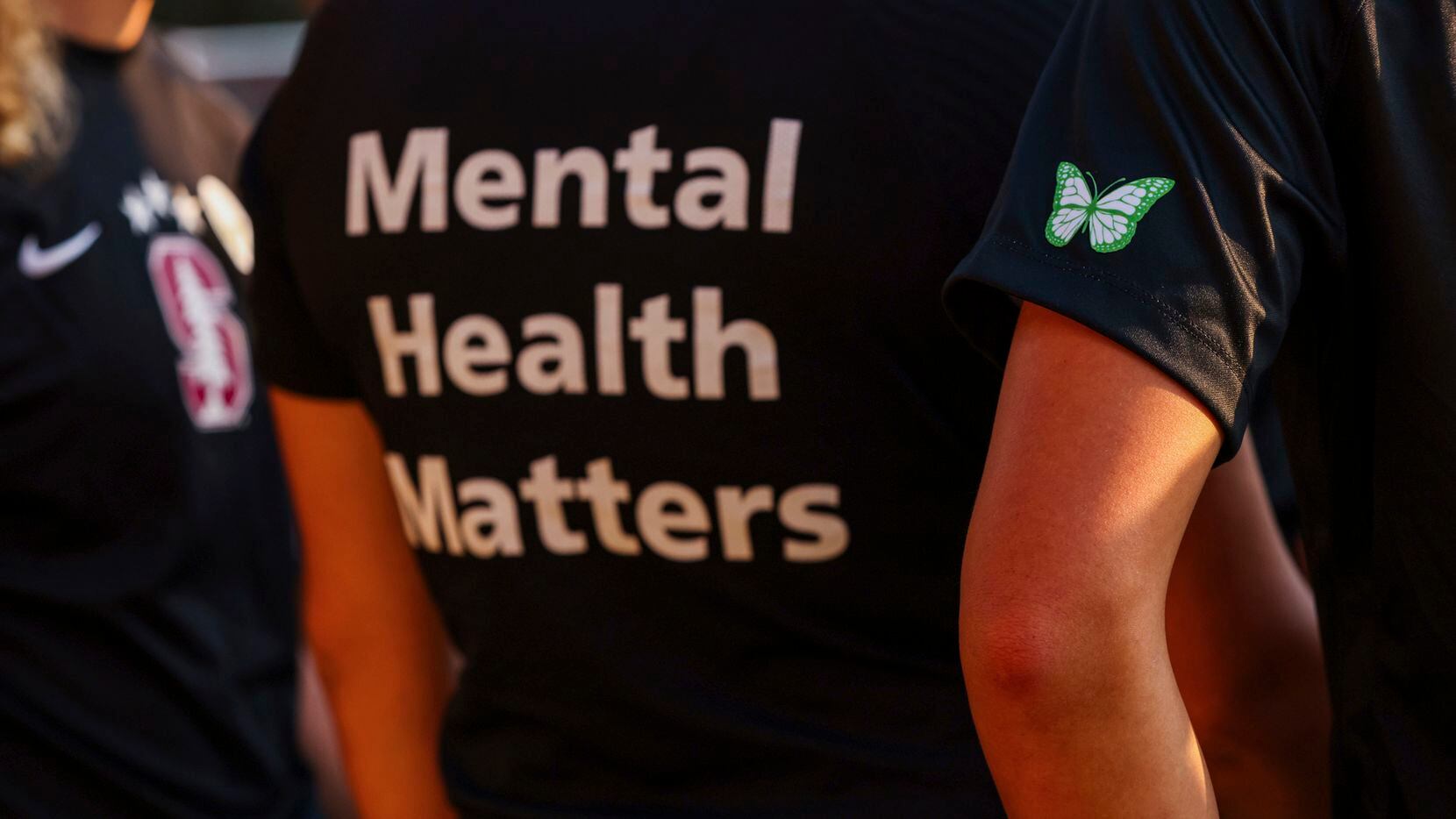 Stanford women's soccer team players wear warmup jerseys with "Mental Health Matters" on...
