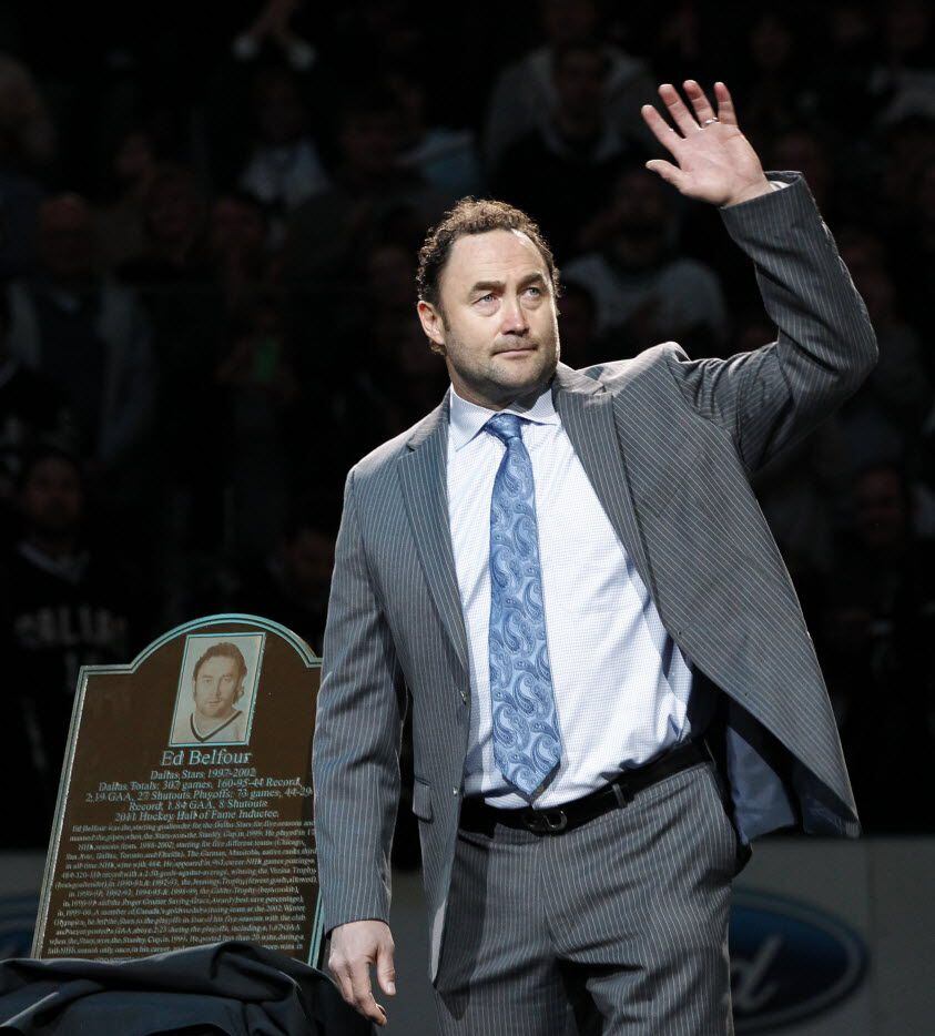 Former Dallas Stars goalie Ed Belfour waves to the crowd during a special presentation for...