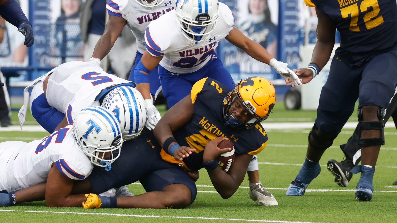 McKinney High’s Bryan Jackson (2) gets tackled during a season-opening football game against...